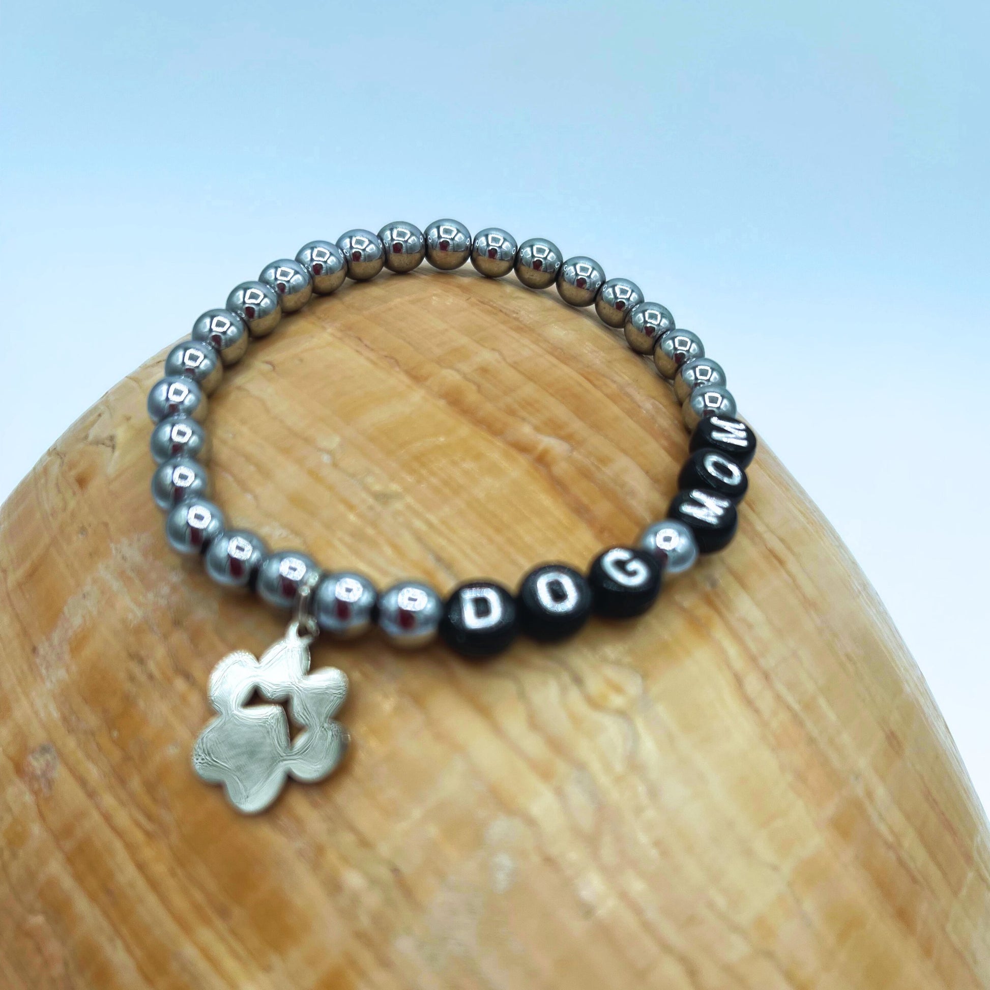 silver  tone paw charm on stretch hematirte dog mom bracelet