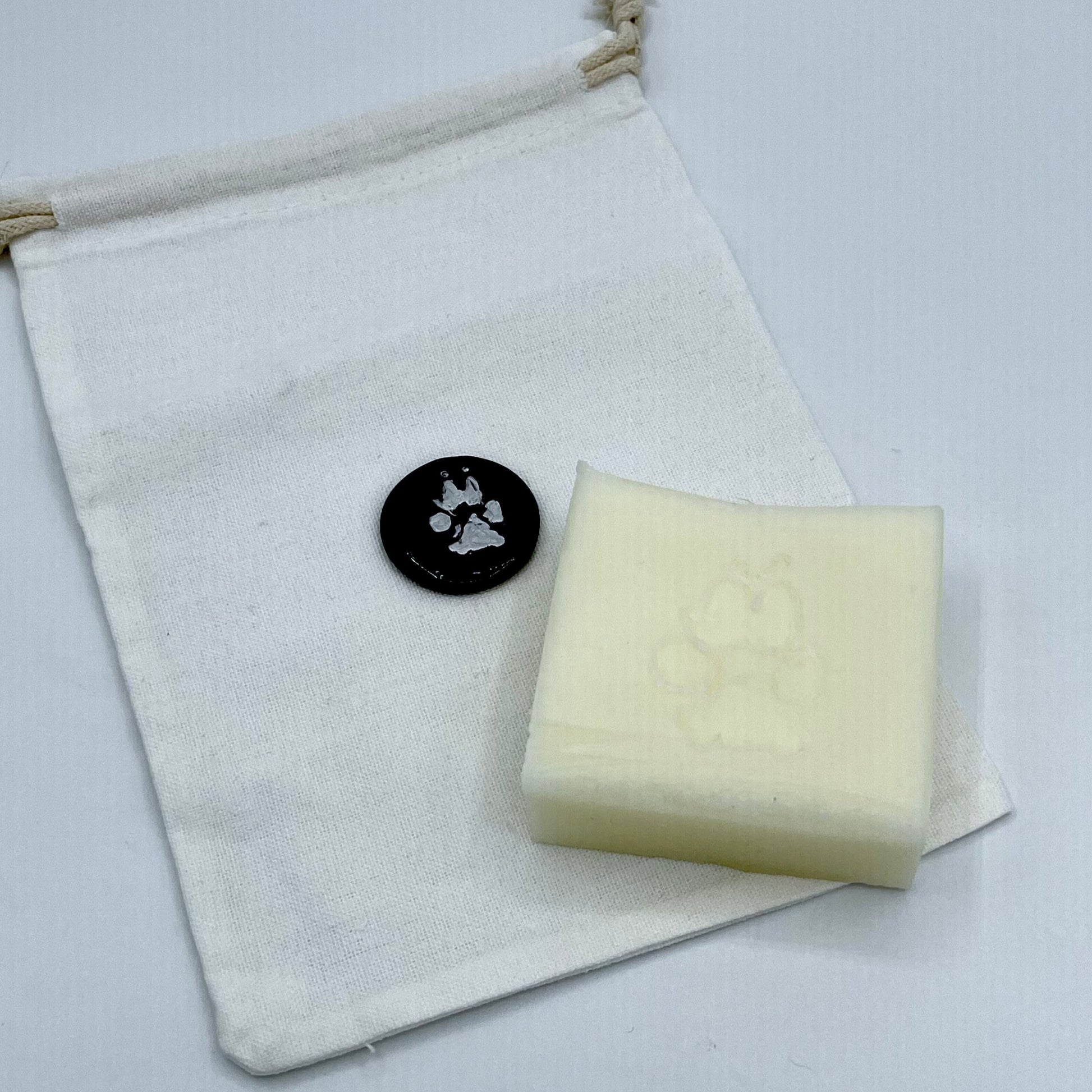 Dog Conditioner bar shown with included bag fpor storing in between baths